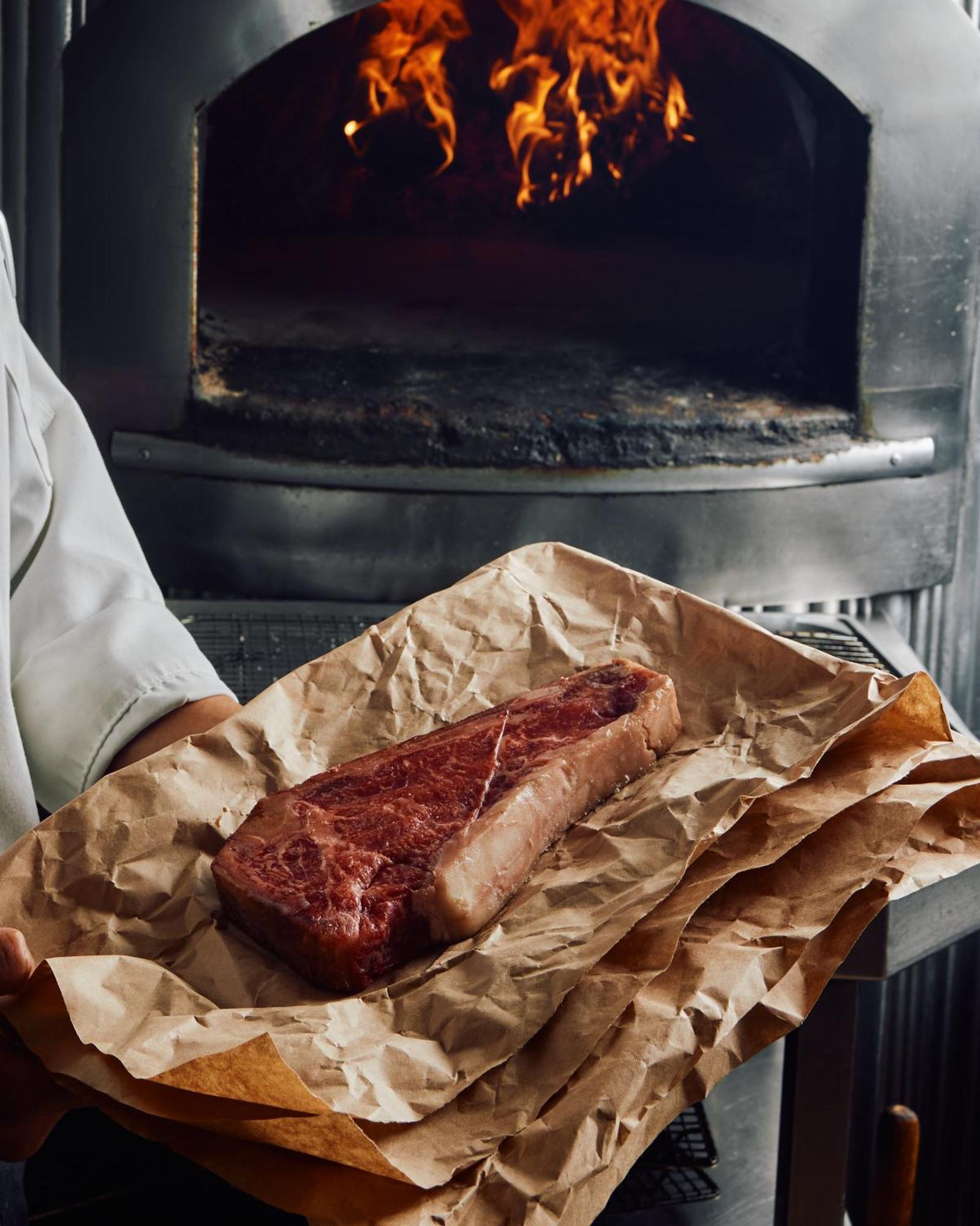 Park Hyatt Melbourne Hotel Екстериор снимка A steak being removed from a wood-fired oven